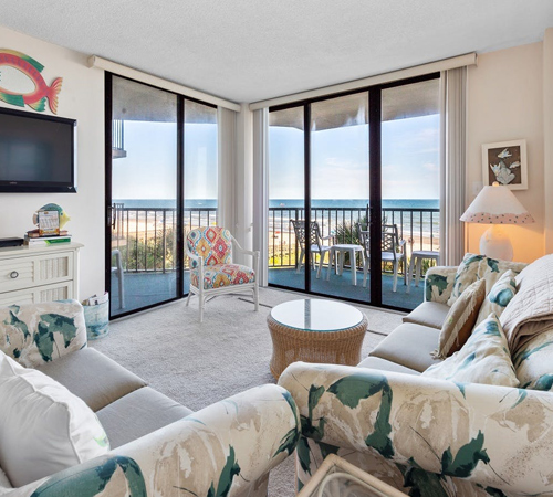 Living room view of an example 2 bedroom condo rental at Crescent Sands